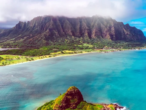 Kualoa mountain ridge, turquoise ocean, and offshore island