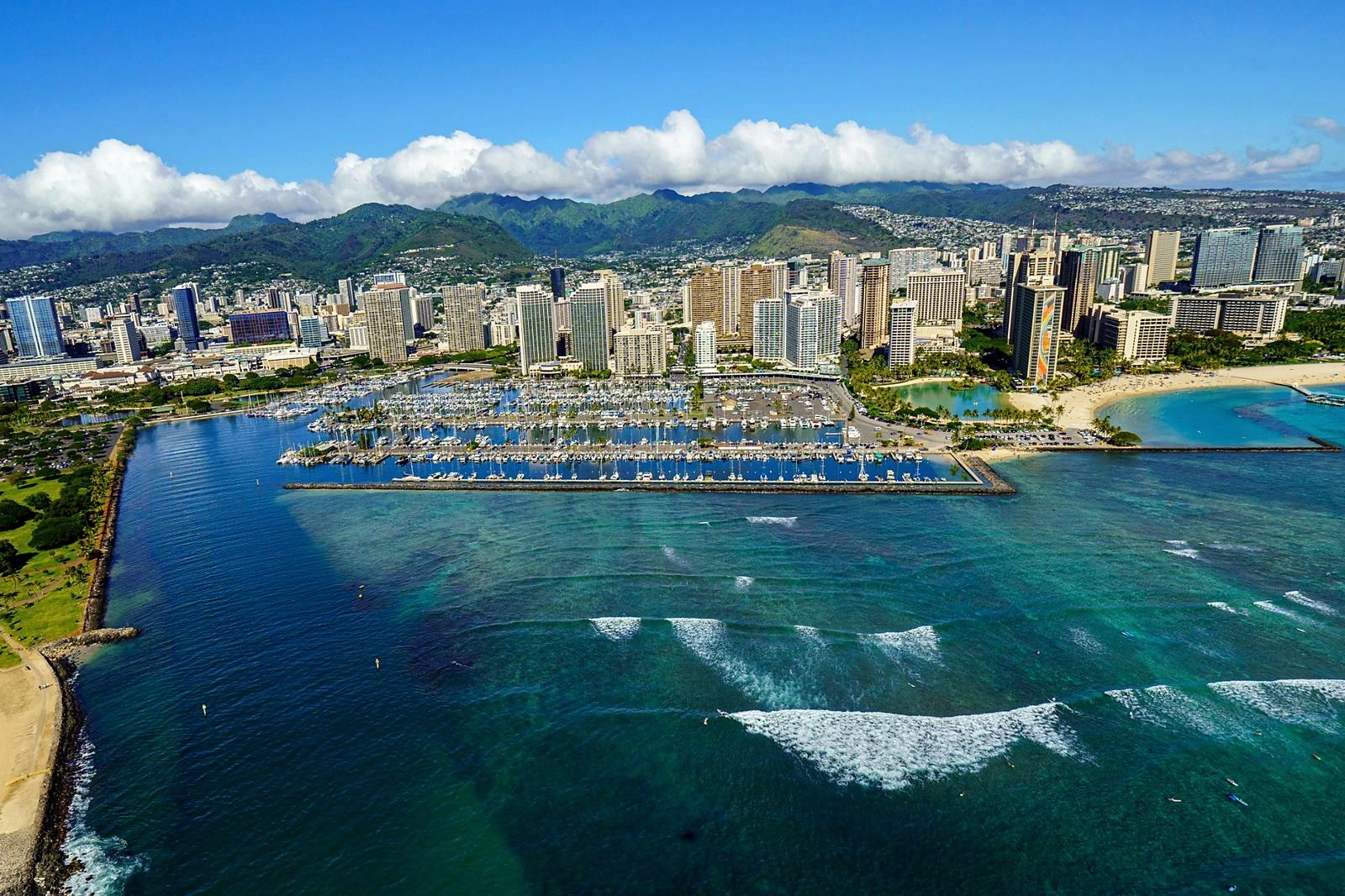 Aerial view of Ala Moana shoreline, marina, and Honolulu high-rise buildings