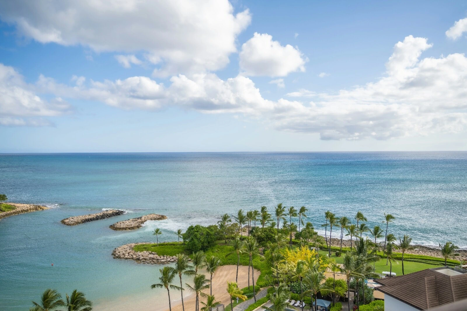 Ocean, lagoon, palms, and shoreline at Four Seasons Resort Oahu at Ko Olina in Kapolei