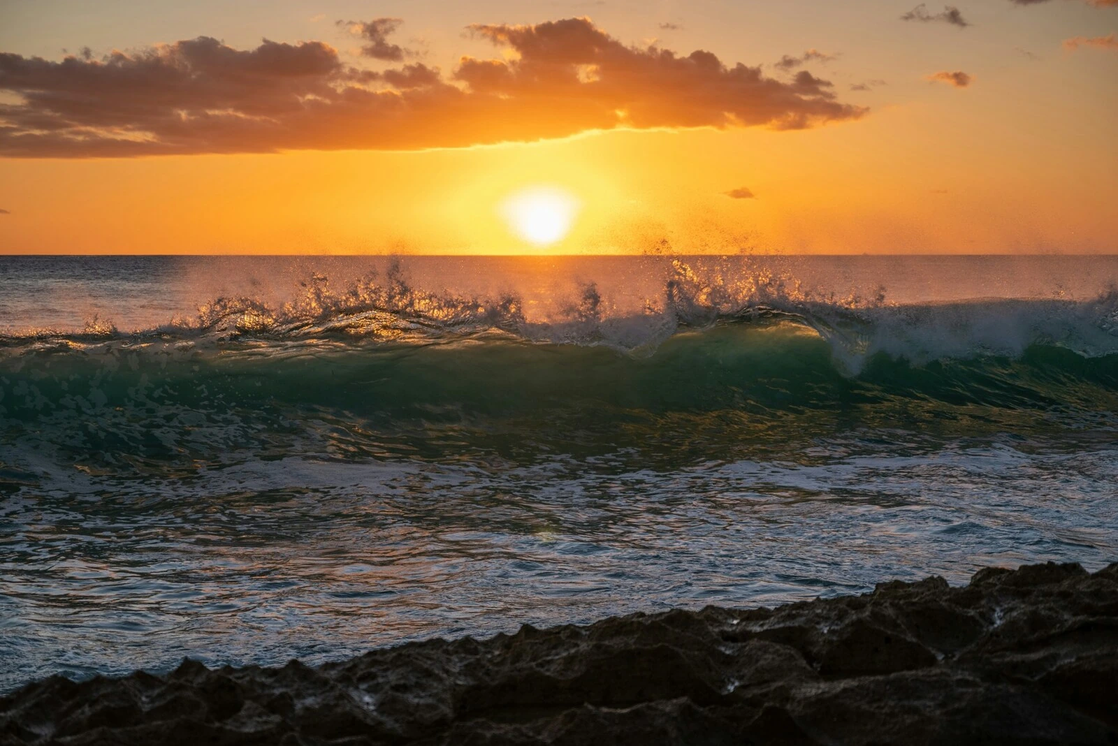 Ocean wave at sunset near Ko Olina Resort in Kapolei